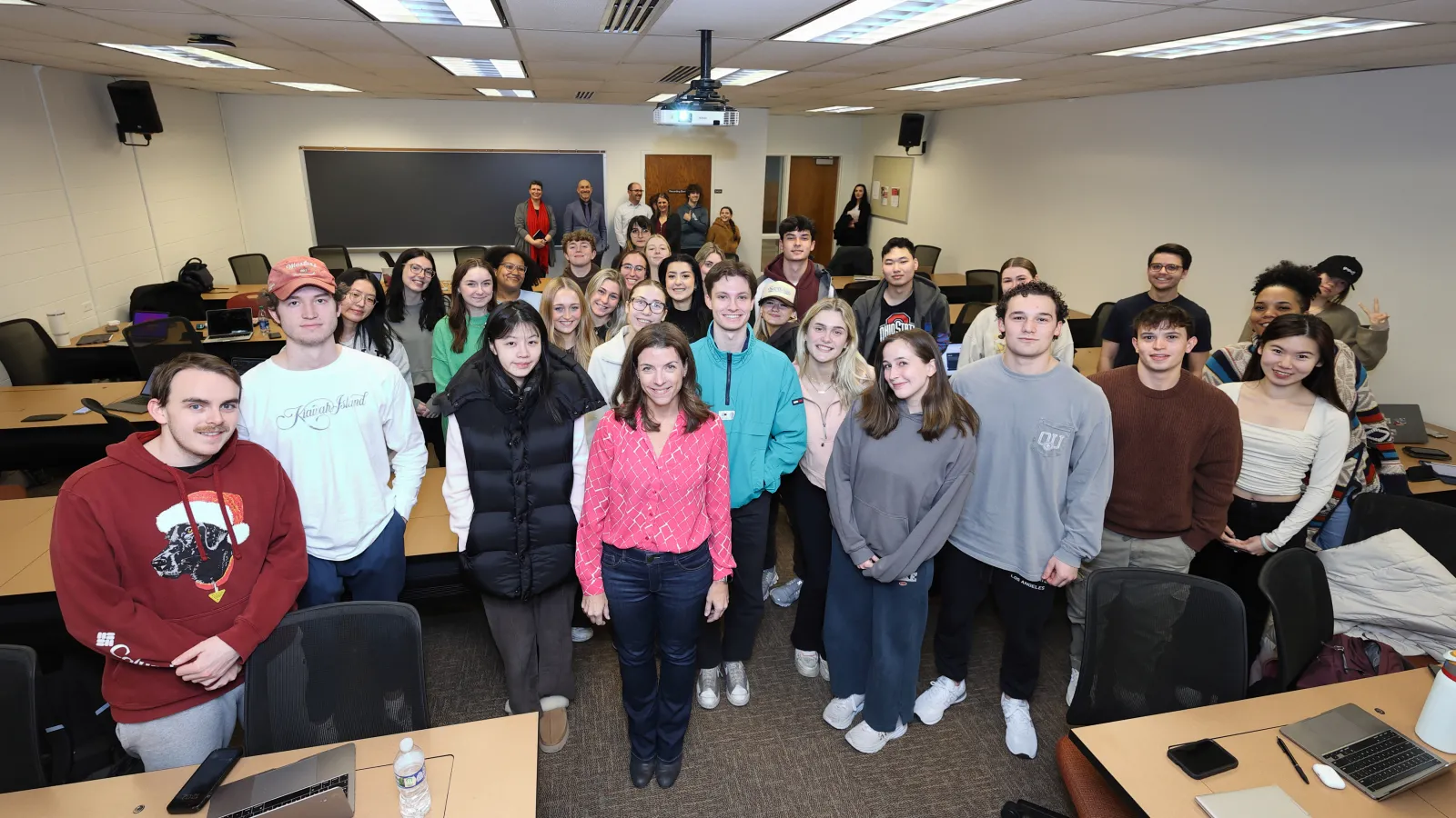Mary Sterenberg accompanied by her students after being surprised with award.